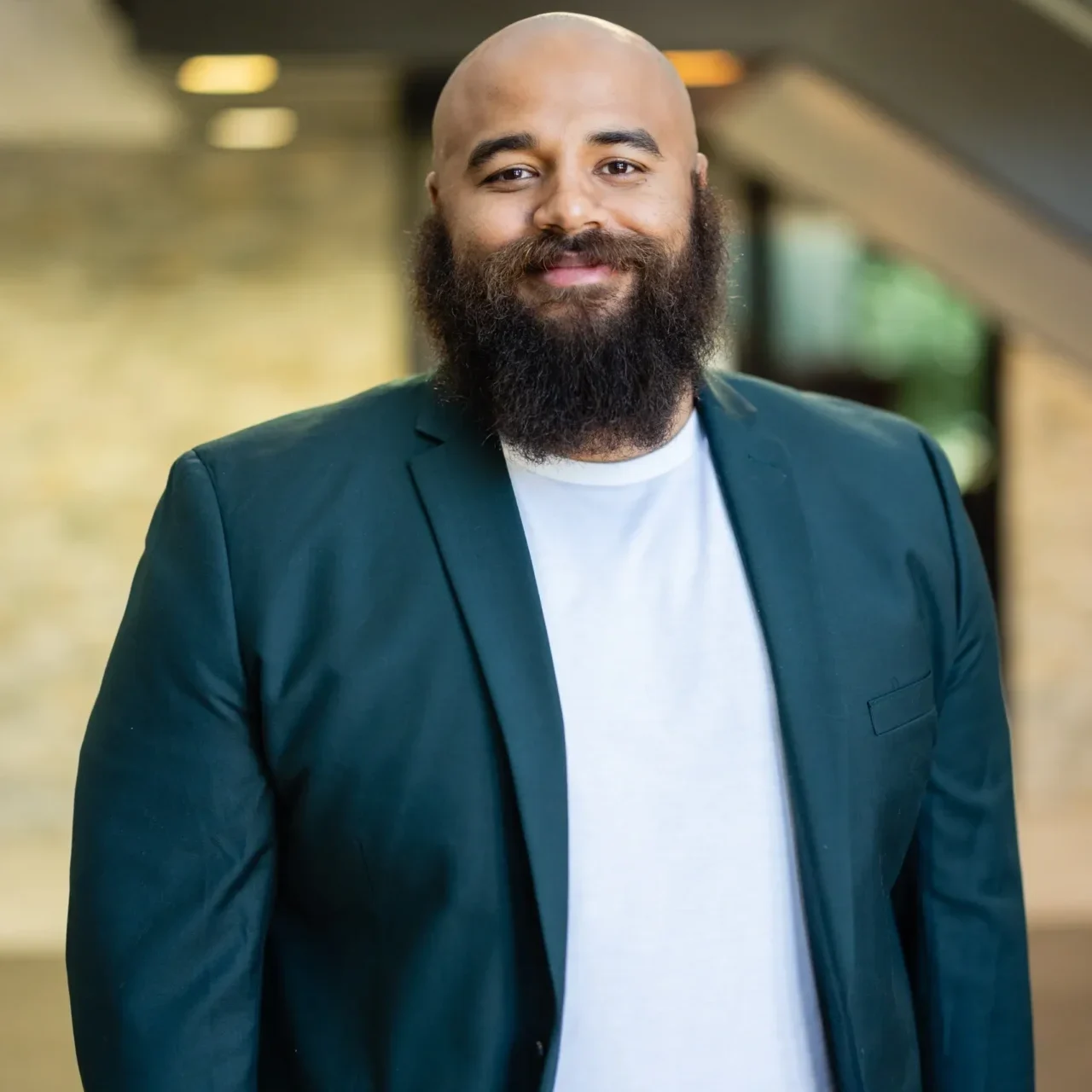 A man with a beard and a jacket